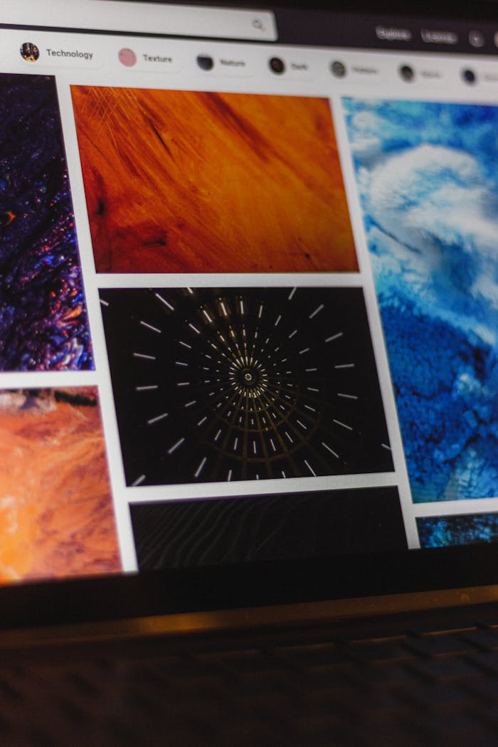 gallery-01 Portable computer with website representing assorted abstract photos under favorites and browser search engine with magnifier symbol